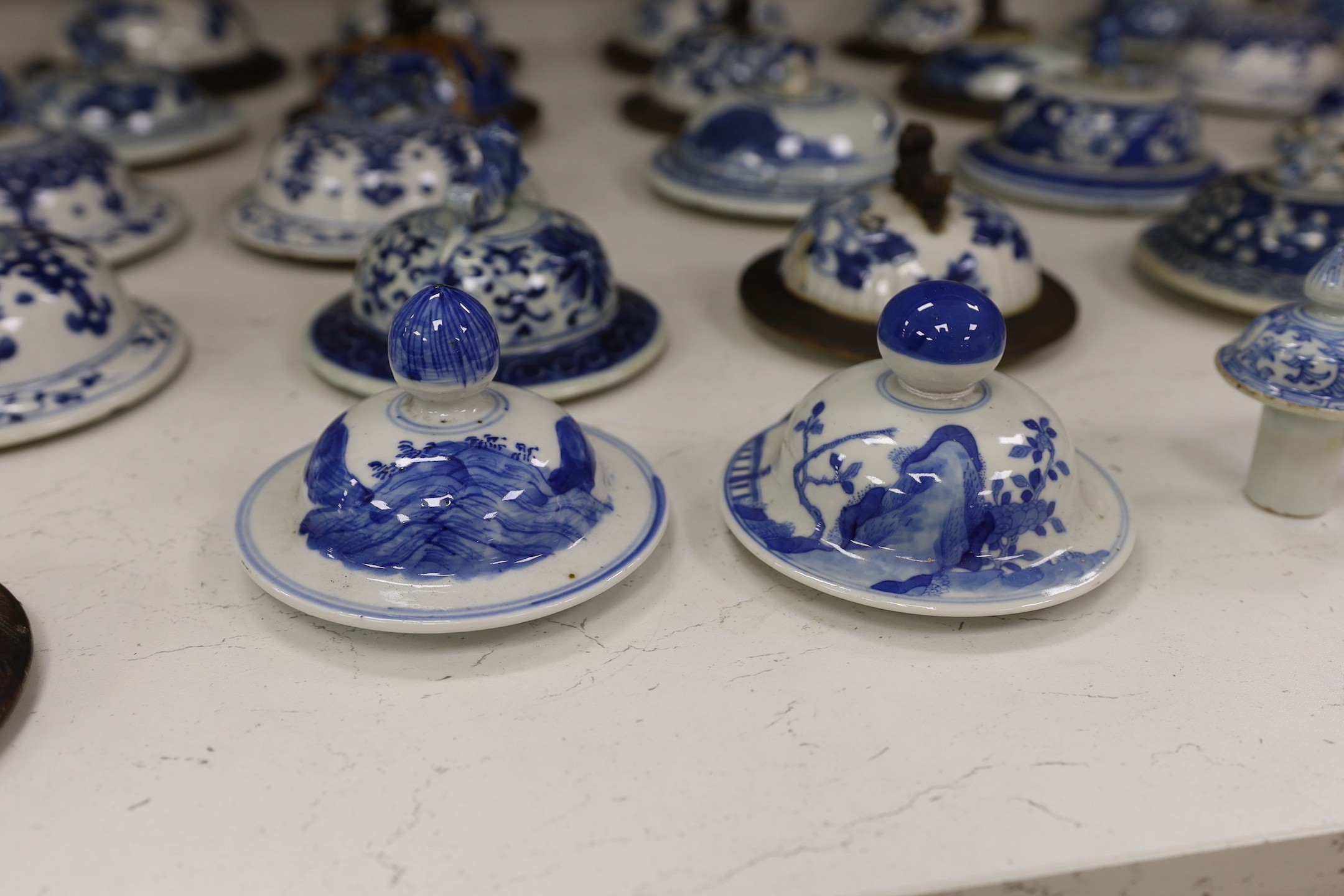 Thirty-seven 18th/19th century Chinese blue and white porcelain covers, 17cm diameter, Provenance - D.C.Monk & Son, former dealers based in Kensington Church Street, London W8